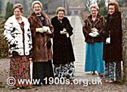 A group of women at an event in the 1950s, all in their fur coats, the 'uniform' of a well-dressed woman.