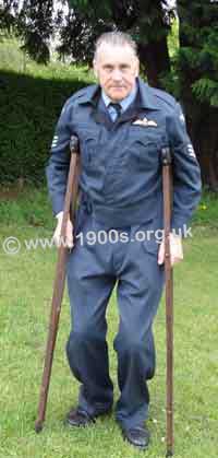 Man on old-style wooden crutches