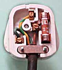 Inside a UK 13 amp plug showing its wiring.