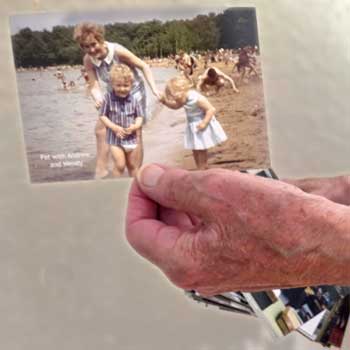 Showing an actual photograph, with a wad of more photos in reserve