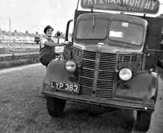 A coal delivery by lorry, mid 20th century UK