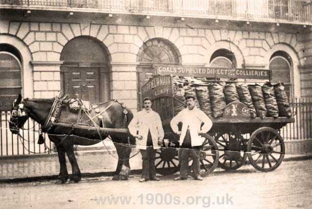 Coal delivery in sacks by horse and cart in early 1900s London. One shilling per cwt.