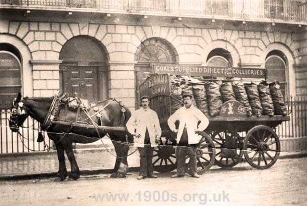 Coal delivered in sacks by horse and cart in early 1900s London. One shilling per cwt.