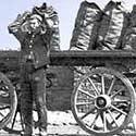 coalman carrying a sack of coal on his back