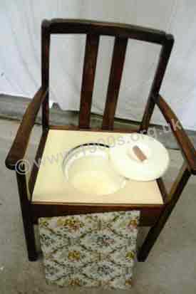 Commode open, showing its chamber pot