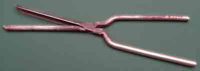 Old metal curling tongs for curling hair