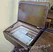 Child's school desk, common in Victorian times to the 1960s, with the lid open to show the space for keeping things