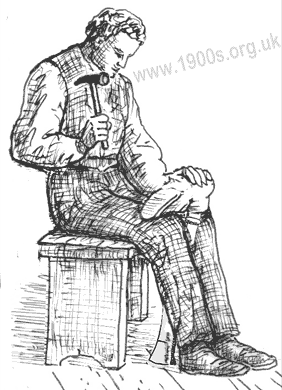 A cobbler, also known as a 'snob' or a shoe-mender in the early 1900s mending a boot.