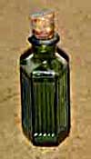 iodine bottle - about 10 cm high in dark green ridged poison bottle, early to mid 20th century