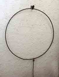 Iron hoop with its rod-like attachment, as used by boys in the early 1900s.