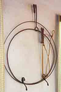 Two iron hoops with their rod-like attachments, as used by boys in the early 1900s.
