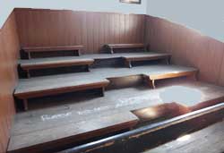 empty raked classroom, better to show the tiers, museum photo