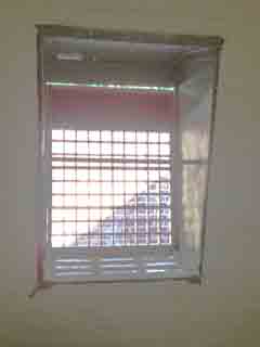 The barred window
of the cell of a casual ward (also known as a dosshouse), which doubled as a sieve or measure for the rocks broken up by the vagrants.