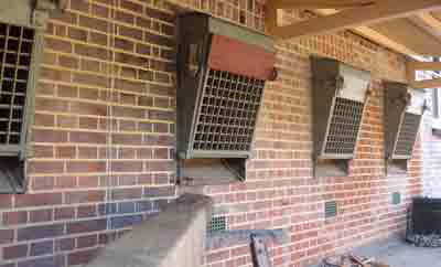 Grid bars on cell windows which could be lowered horizontal to to act as sieves to keep the broken rocks small