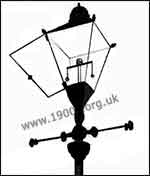 Gas street lamp working parts: hinged glass pane for access to the mantles, chains for opening and closing the gas supply