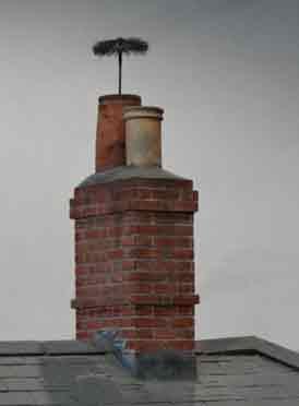 Chimney sweep's brush at the top of a chimney, showing that the chimney had been swept properly: Victorian to mid 20th century