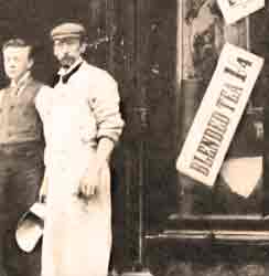 Tea merchant in the early 1900s carrying the pan of scales suitable for digging out tea from a sack