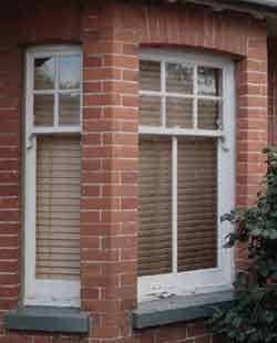 Wooden venetian blinds -closed to show respect for a funeral, early 20th century