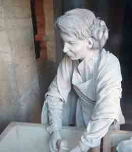 Woman workhouse inmate doing washing, front view. 
