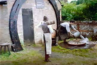 blacksmith/wheelwright with hot rim of wheel