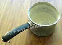 Old egg saucepan with scale built up inside it